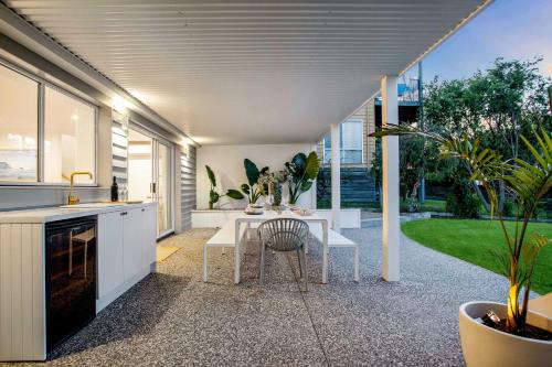 a kitchen with a table and some plants at Luxe Oceanview - Bay Views Beach & Wineries in Dromana