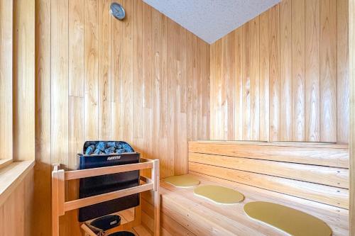 a sauna with wood paneled walls and aperature at Nagisato Villa Clover in Takamatsu