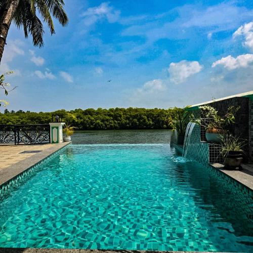 a swimming pool with a view of a river at Nico's in Polem