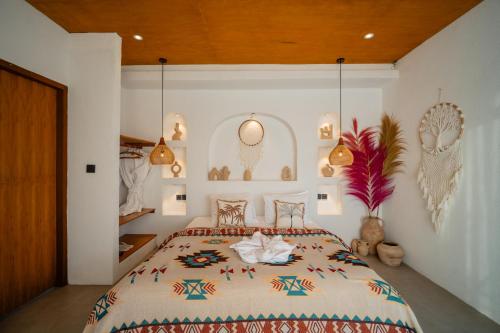 a bedroom with a large bed in a room at Stone Ridge Kintamani in Kintamani