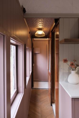 a hallway of a home with a door and a window at The Station Hunter Valley in Pokolbin