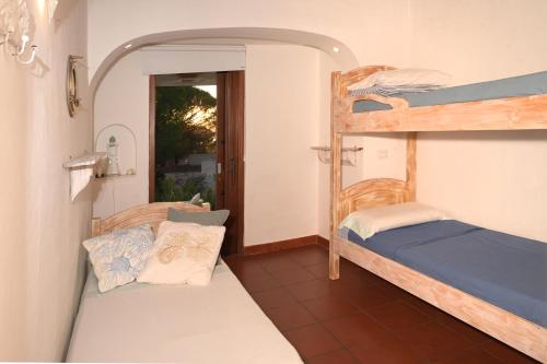 Postel nebo postele na pokoji v ubytování La casa dei tramonti