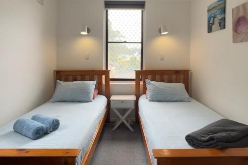 Ένα ή περισσότερα κρεβάτια σε δωμάτιο στο Surfrider 11