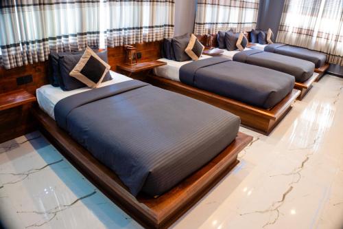 a row of beds on a cruise ship at Supreme Dambulla in Dambulla