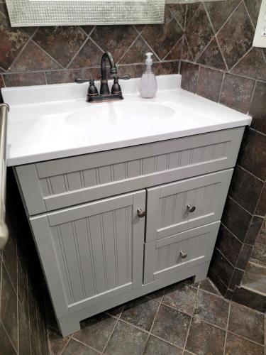 a bathroom vanity with a white sink at Two bedroom private guesthouse in great location Close to Melrose Hollywood sign and attractions in Los Angeles