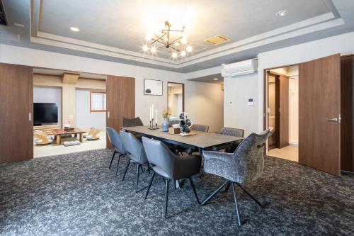 a dining room with a table and chairs at b&Namba 1 in Osaka