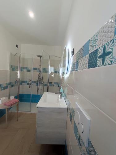 a bathroom with a sink and a mirror at Stefanelli Tropea Home in Tropea