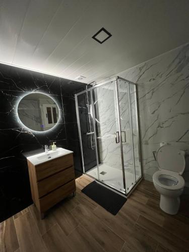 a bathroom with a shower and a sink and a toilet at Modern apartment 2 Barcelona in Santa Coloma de Gramanet