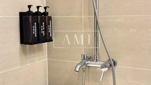 a shower with a faucet in a bathroom at Cyberjaya - Puchong Luxury Private Swimming Pool Villa with BBQ - Corner lot up to 20 Guests in Puchong