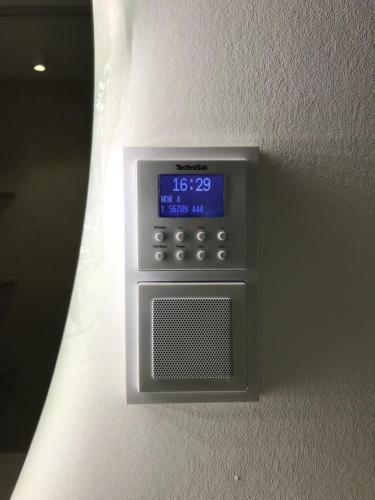 an electronic clock on the wall in a room at Meckenheim in Meckenheim