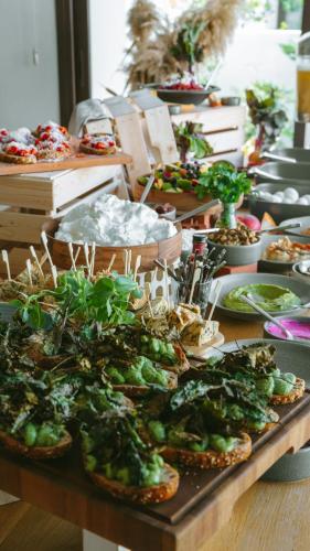 a table with a bunch of plants on top at LIV & CO Suites & Villas in Voroklini