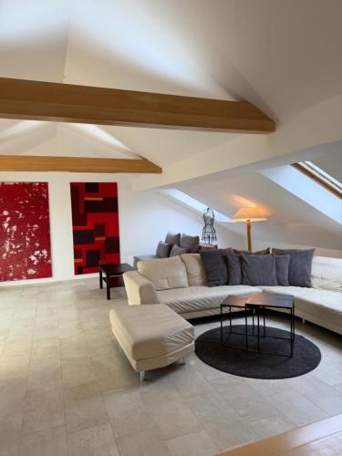 a living room with a couch and a table at undertheroof at in Salzburg
