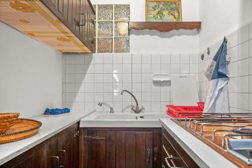a kitchen with a sink and a counter at Appartement 1er étage in Castellane