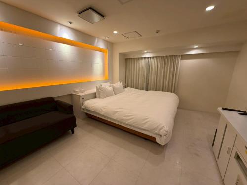 Voodi või voodid majutusasutuse Hotel Rima chocolat toas