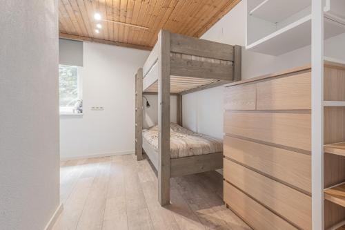 En eller flere senge i et værelse på Haus Dienten TOP 4