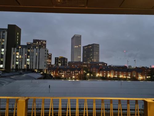 a view of a city skyline at night at Luxury 2 Bed Apartment, with a balcony city & canal view in Manchester City Centre! in Manchester