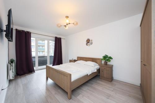 Postel nebo postele na pokoji v ubytování Anima Apartments - Coresi