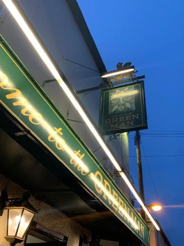 a sign for a restaurant on the side of a building at The Green Man in Dunchurch