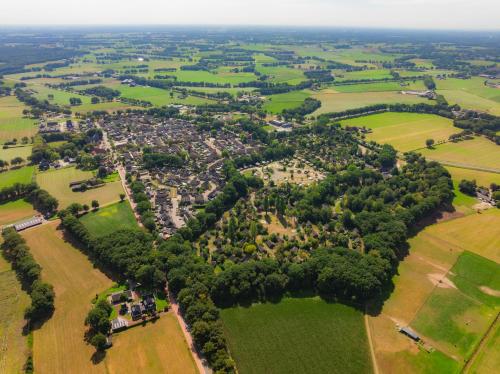 an aerial view of a village with trees and fields at Vakantiepark Sallandshoeve in Nieuw-Heeten