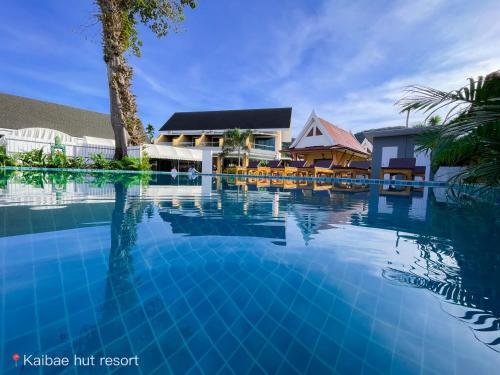 a swimming pool in front of a resort at Kaibae Hut Resort in Ko Chang