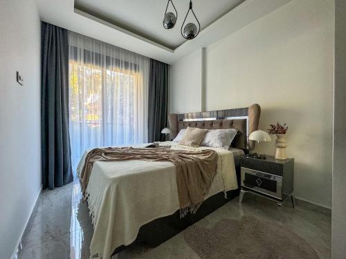 Katil atau katil-katil dalam bilik di Qoople Saga designer apartments in the heart of Alanya