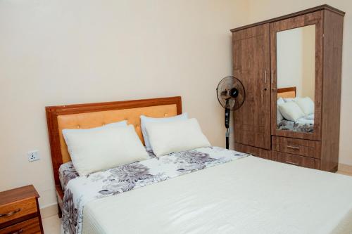 Postel nebo postele na pokoji v ubytování THELIGHT HOTEL KIGALI Rwanda