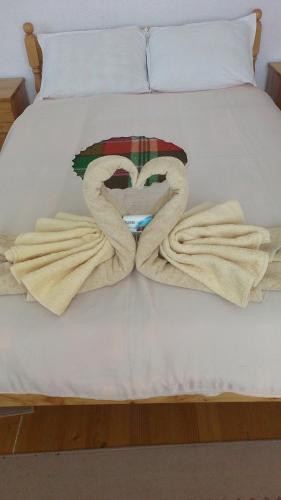 Ένα ή περισσότερα κρεβάτια σε δωμάτιο στο Guest House Jani