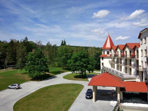 arial view of a building with a red roof at Hotel Nowy Zdrój - Centrum Zdrowia i Wypoczynku in Polanica-Zdrój