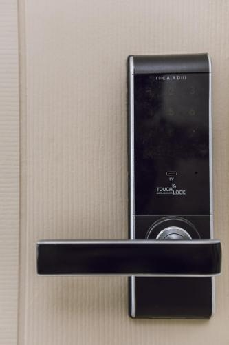 a cell phone is attached to a wall at Fin Banchang in Ban Chang