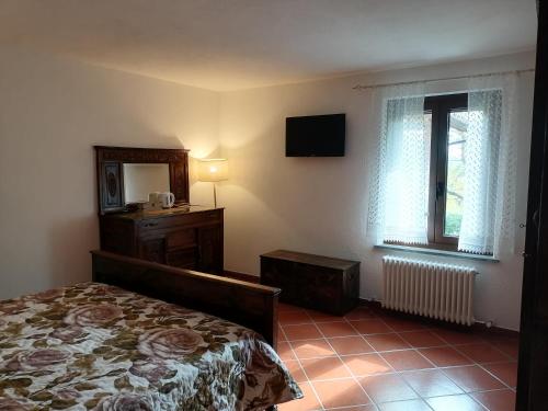 Postel nebo postele na pokoji v ubytování Cascina Frati