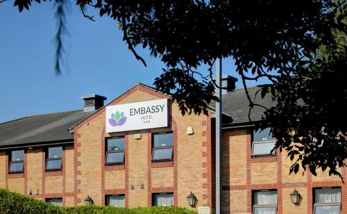 a building with a sign on the side of it at Embassy Hotel, Newcastle City Centre, Sure Collection by Best Western in Newcastle upon Tyne