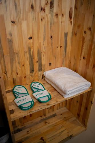 a bed in a sauna with two muzzles at Cemara Indah Hotel in Bromo