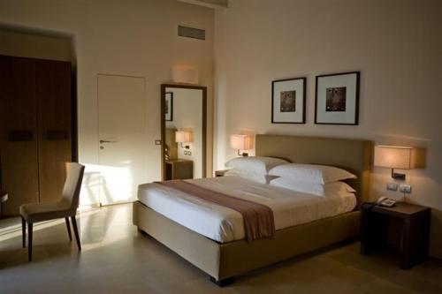 Maré Resort tesisinde bir odada yatak veya yataklar