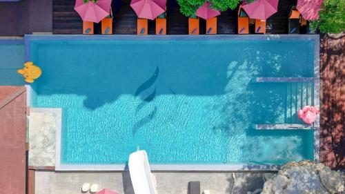 a swimming pool with a shark in the water at Phuvaree Resort in Patong Beach