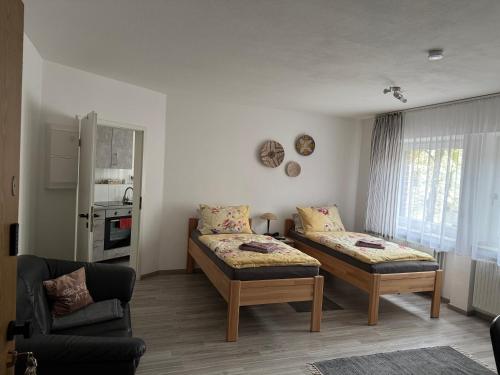 a living room with two beds and a couch at Hüls Central Apartment in Marl