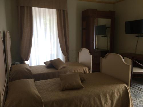 Кровать или кровати в номере Hotel Sant'Anna