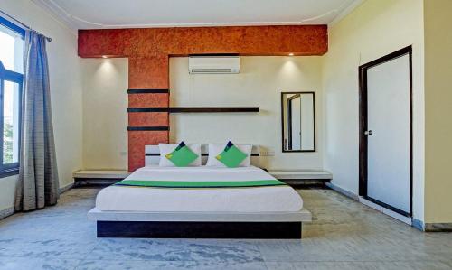 a bedroom with a large bed in a room at Hotel Nomadic in Udaipur