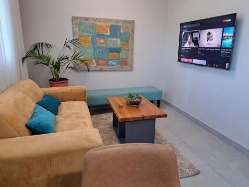 a living room with a couch and a table at Hadeda Road 3 in Johannesburg