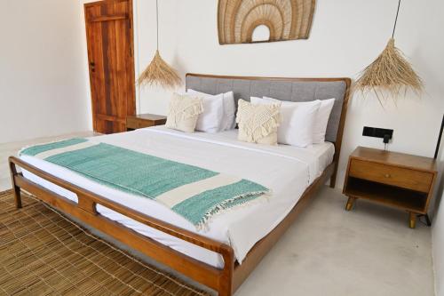 Ένα ή περισσότερα κρεβάτια σε δωμάτιο στο Mawimbi Zanzibar