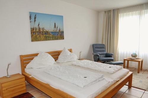 Ένα ή περισσότερα κρεβάτια σε δωμάτιο στο NB 04 - Ferienwohnung 3 Zimmer Seeblick