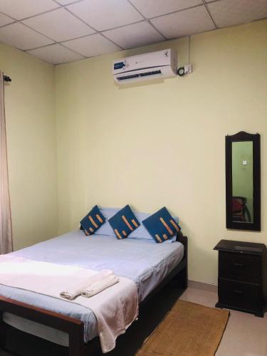 Ένα ή περισσότερα κρεβάτια σε δωμάτιο στο Little Nest