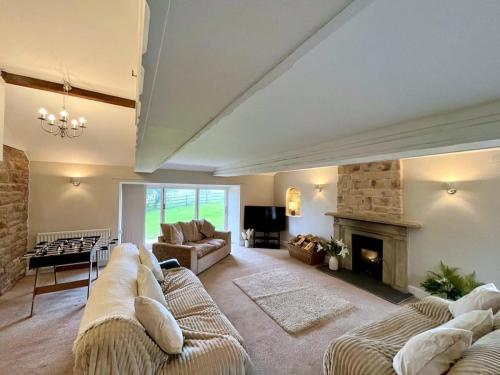 a living room with a couch and a fireplace at 3 Bed in Mealsgate oc-e33626 in Mealsgate