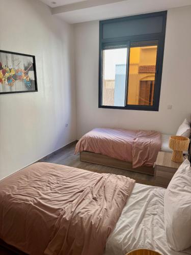 Postel nebo postele na pokoji v ubytování dar houdou