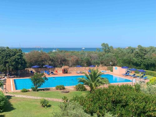an image of a swimming pool at a resort at Sardegna Beach Ginepro in Olbia