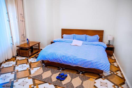 Postel nebo postele na pokoji v ubytování maman home apartment