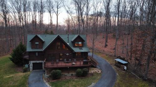 an aerial view of a house in the woods at Wilderness retreat in Marion