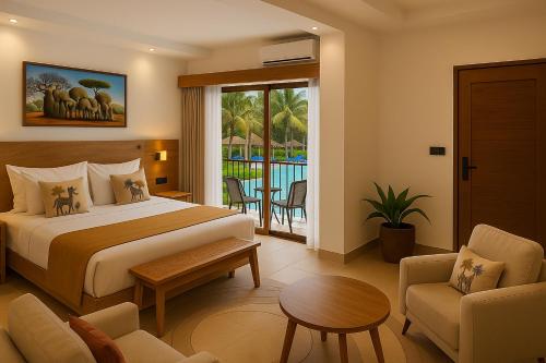 a hotel room with a bed and a table and chairs at JAZ Amaluna in Uroa