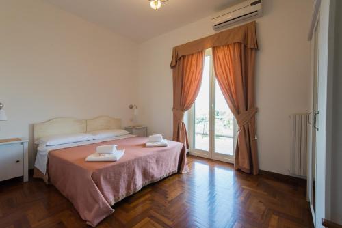 Postel nebo postele na pokoji v ubytování Bed and Breakfast Nonna Loreta