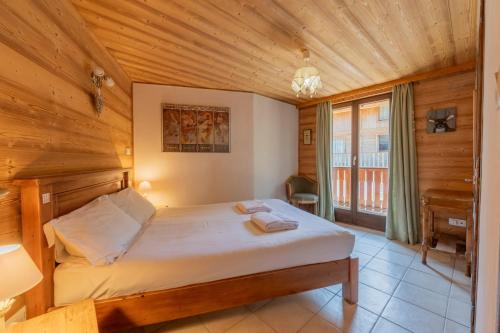 Postel nebo postele na pokoji v ubytování Clos Donne Apartment - Snow and Trek- Essert Romand