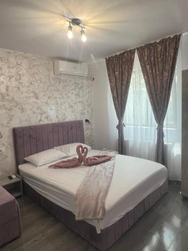 a bedroom with a bed with two octopus on it at Ama boutique in Constanţa